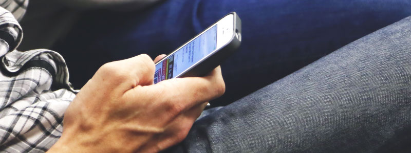 man on mobile email